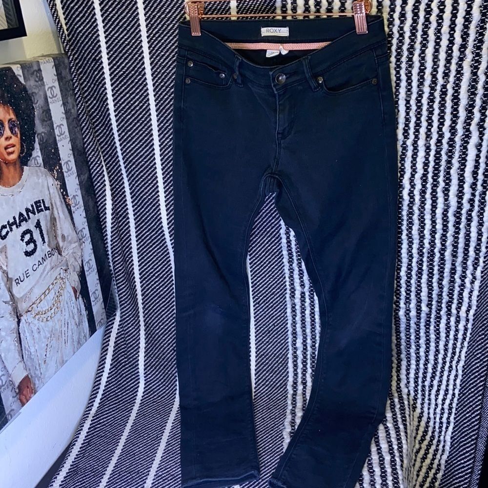 Roxy black distressed skinny jeans.